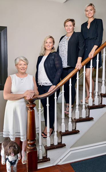 Stelzer Law team poses on staircase